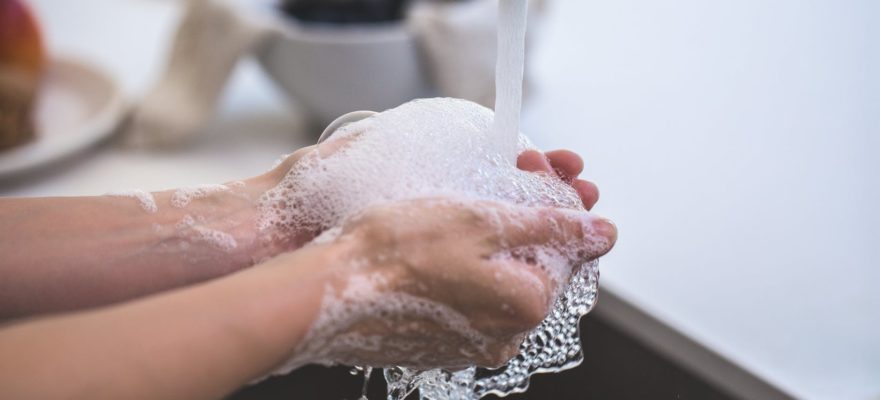 person washing his hand