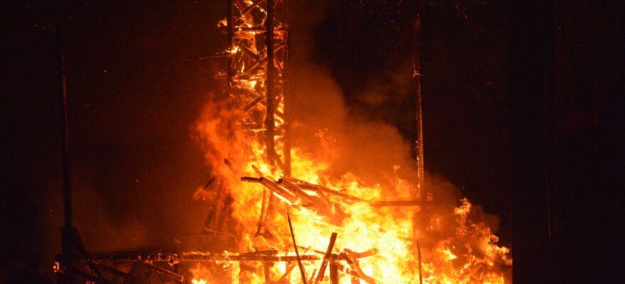 burning wood tower during night time