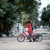 kids riding a tricycle