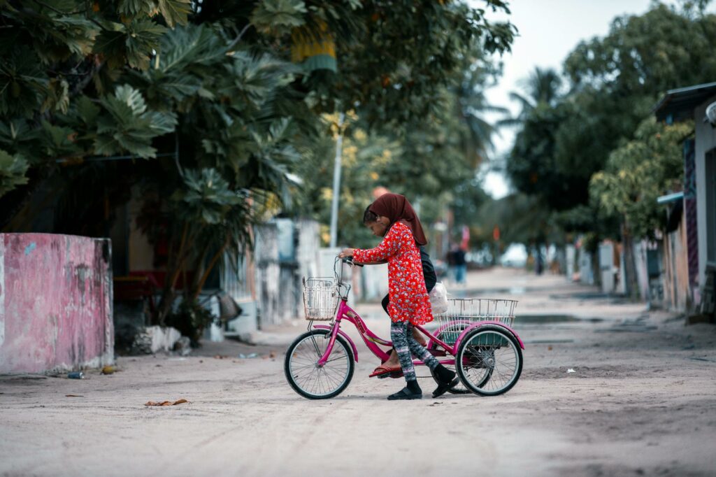 kids riding a tricycle