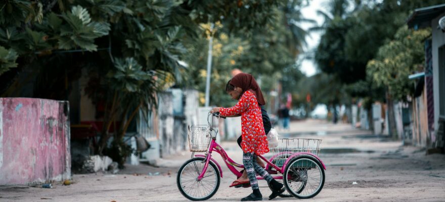 kids riding a tricycle