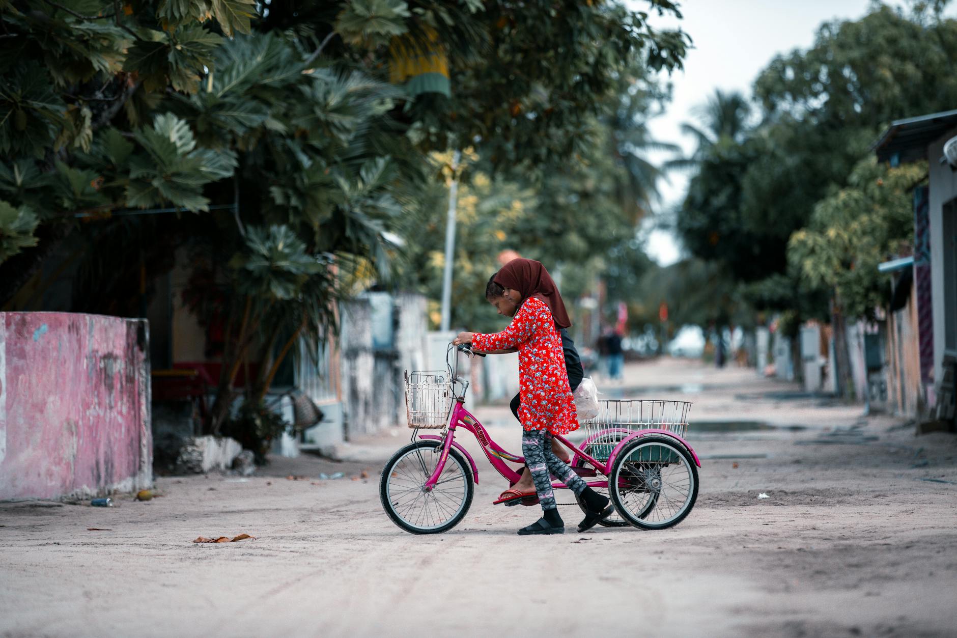 kids riding a tricycle