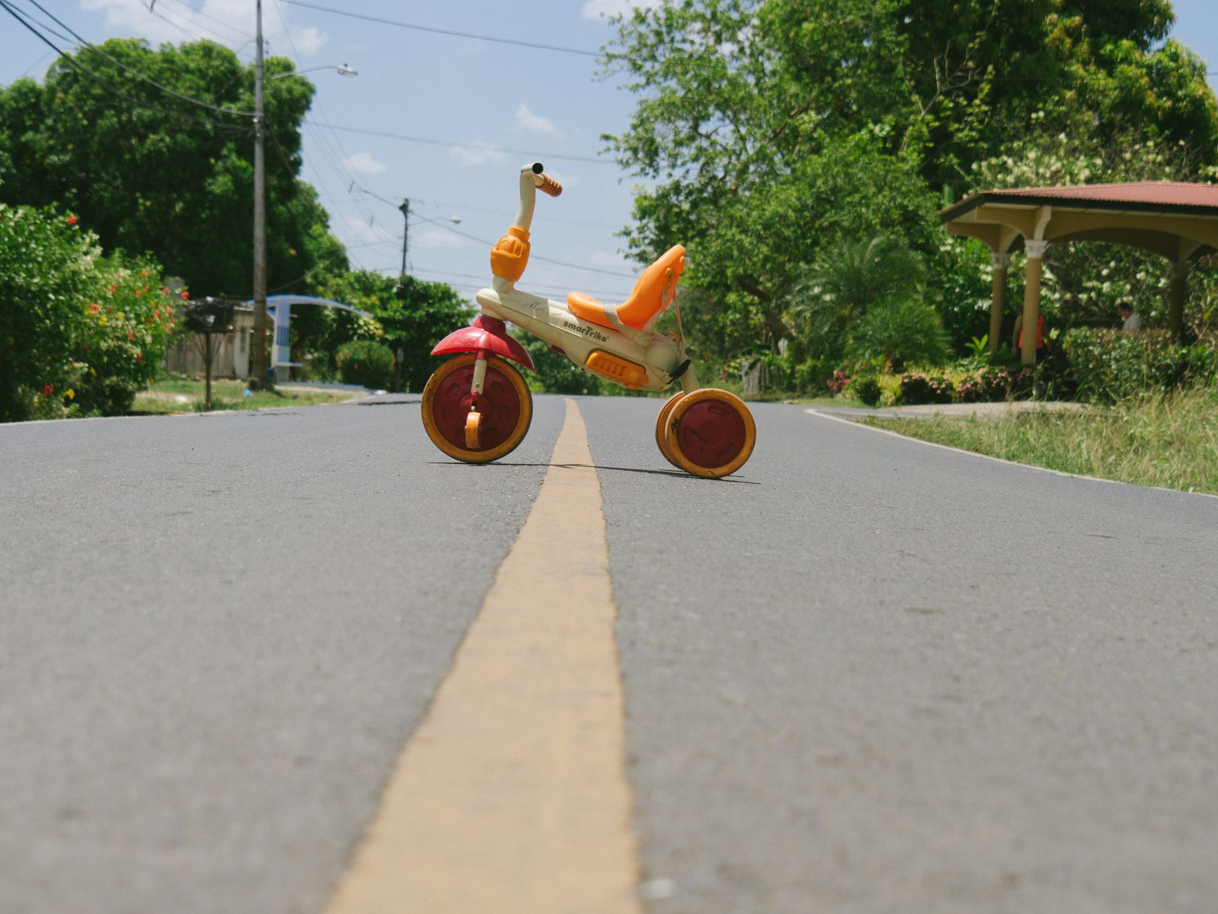 a plastic kids bike on the street