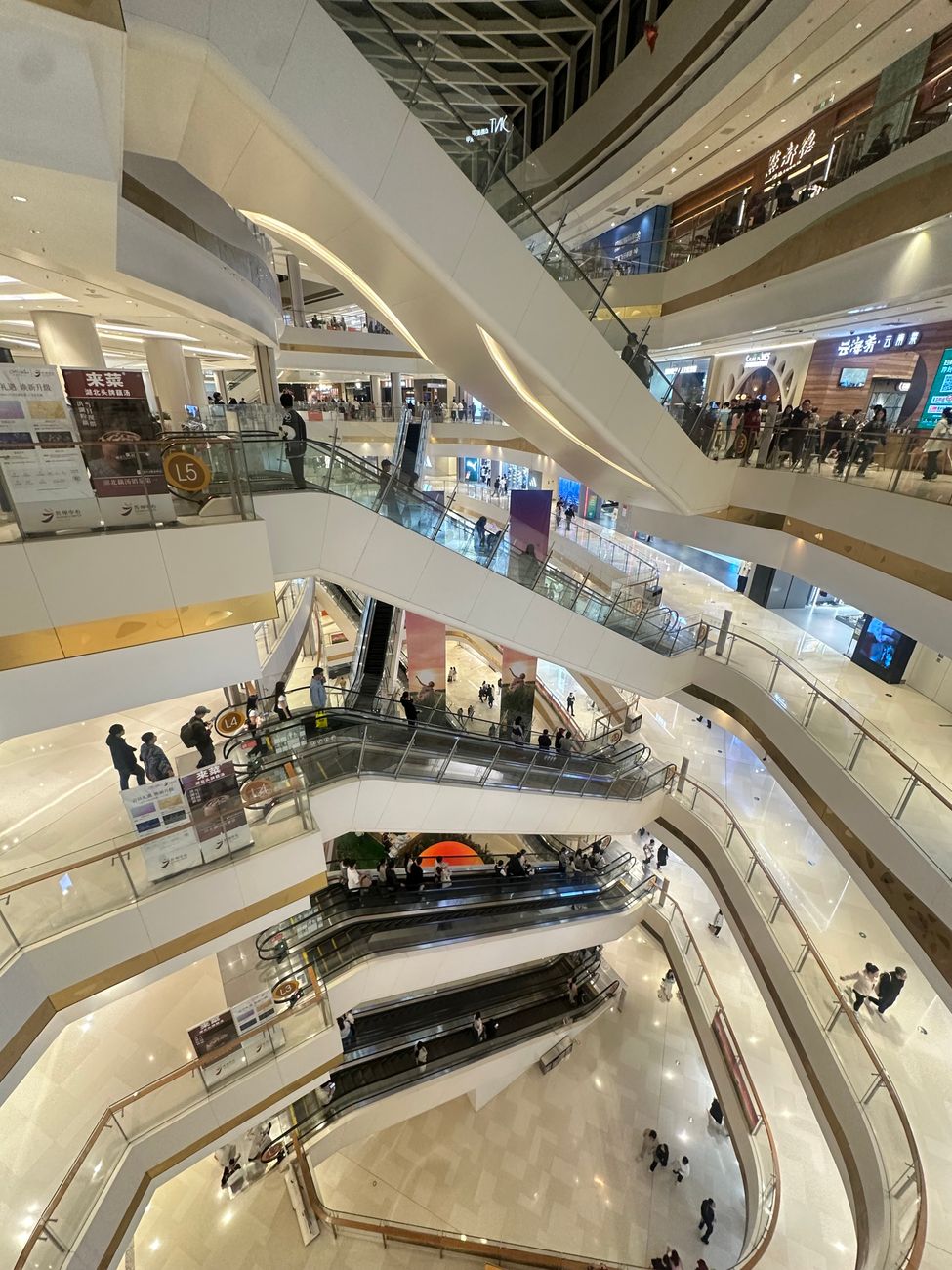 modern shopping mall interior with escalators